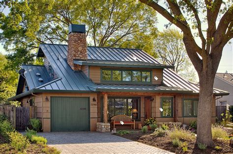 house colors that go with green metal roof|green roof house color schemes.